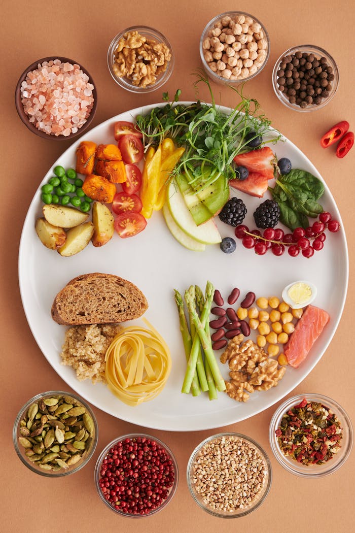 journey A vibrant assortment of healthy foods on a plate, showcasing a balanced diet with fruits, vegetables, nuts, and grains.